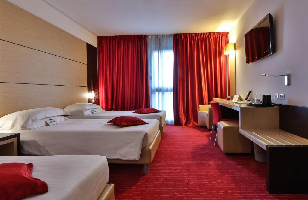 Postel nebo postele na pokoji v ubytování Best Western Plus Hotel Galileo Padova