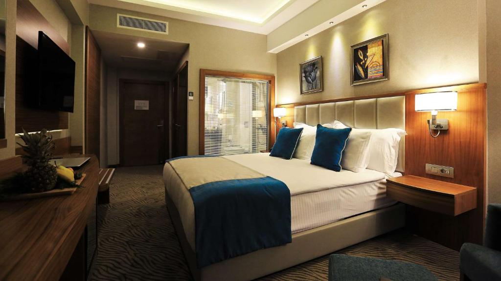 Postel nebo postele na pokoji v ubytování Best Western Premier Karsiyaka Convention & Spa Hotel