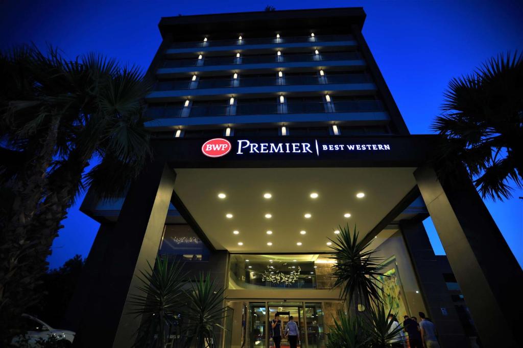 a building with a sign that reads premier hypervisor at Best Western Premier Karsiyaka Convention & Spa Hotel in Izmir