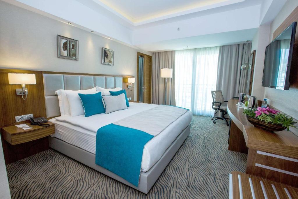Postel nebo postele na pokoji v ubytování Best Western Premier Karsiyaka Convention & Spa Hotel