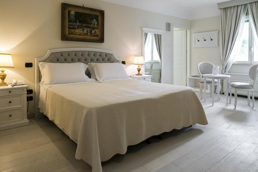 Postel nebo postele na pokoji v ubytování Sangiorgio Resort & Spa