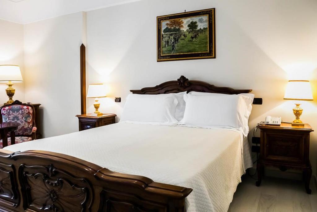 Postel nebo postele na pokoji v ubytování Sangiorgio Resort & Spa