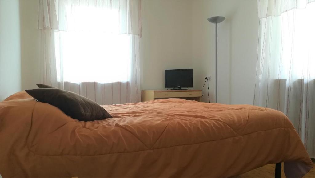 Postel nebo postele na pokoji v ubytování Hotel Tomei