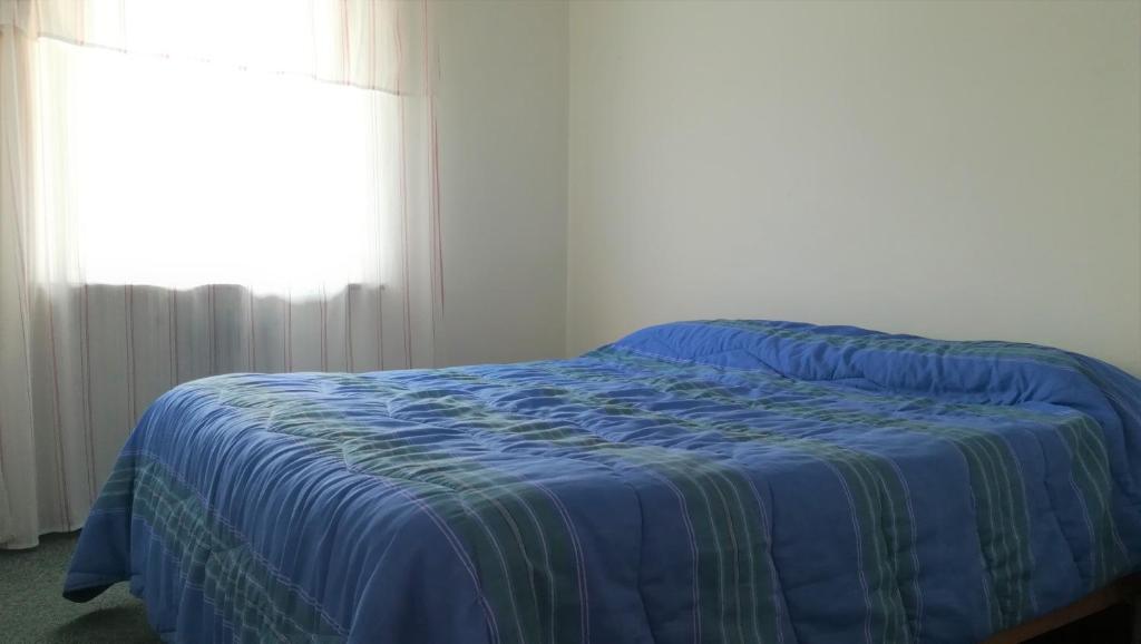 Postel nebo postele na pokoji v ubytování Hotel Tomei