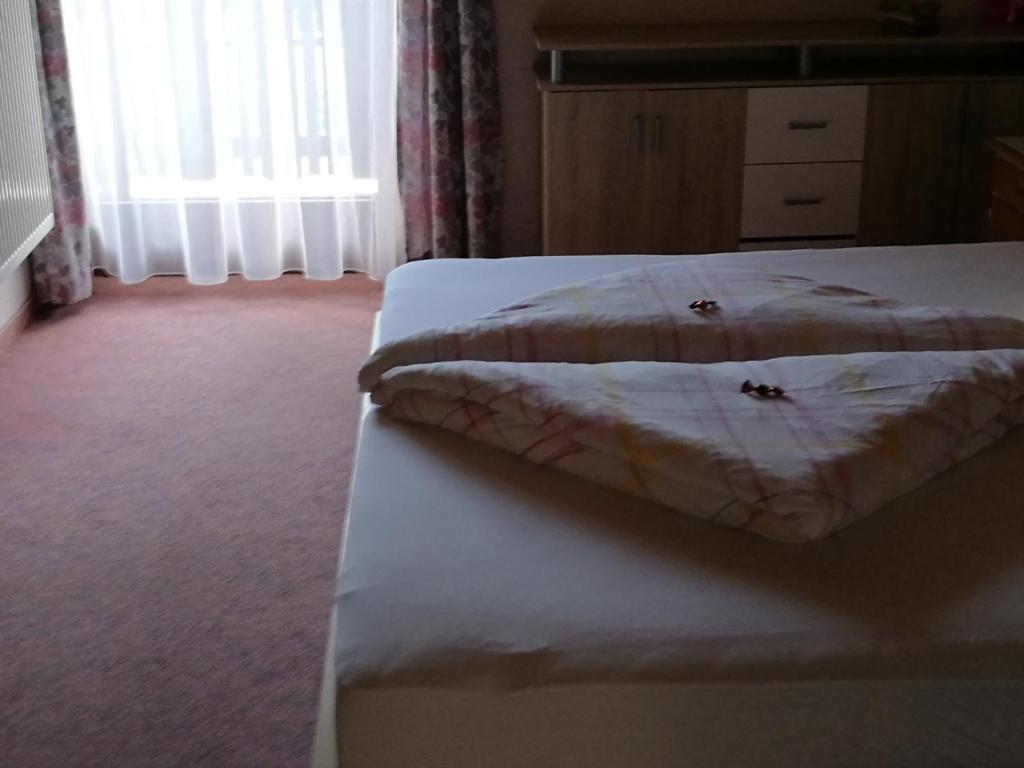 Postel nebo postele na pokoji v ubytování Gästepension Wiesenheim