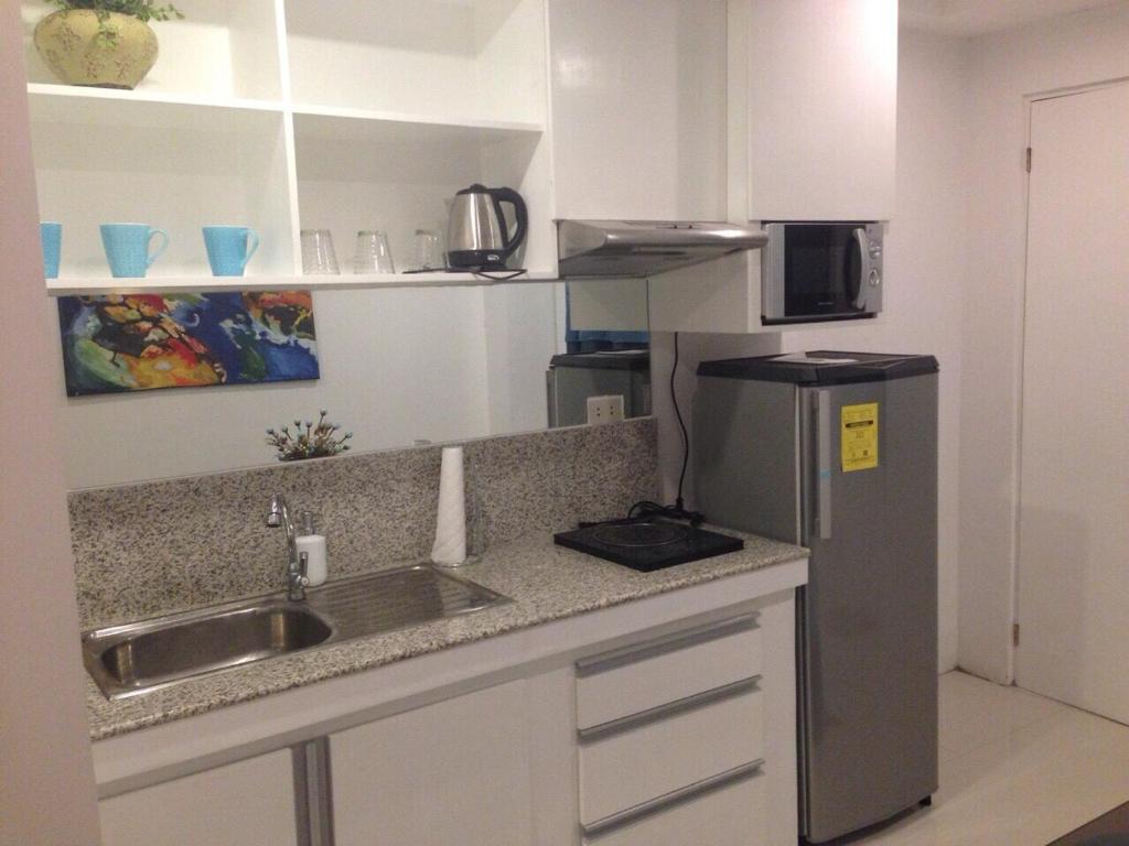 Kuchyň nebo kuchyňský kout v ubytování Alta Residences