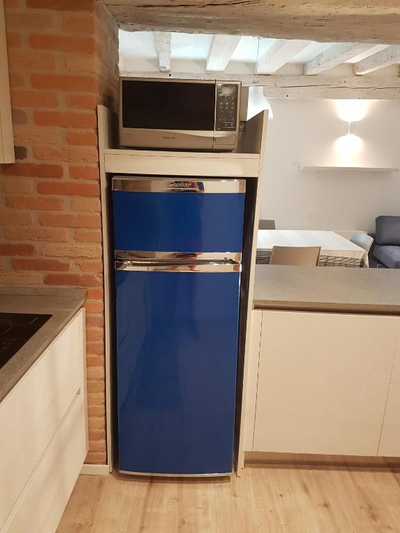 A kitchen or kitchenette at CORTE SCONTA Mini-Loft