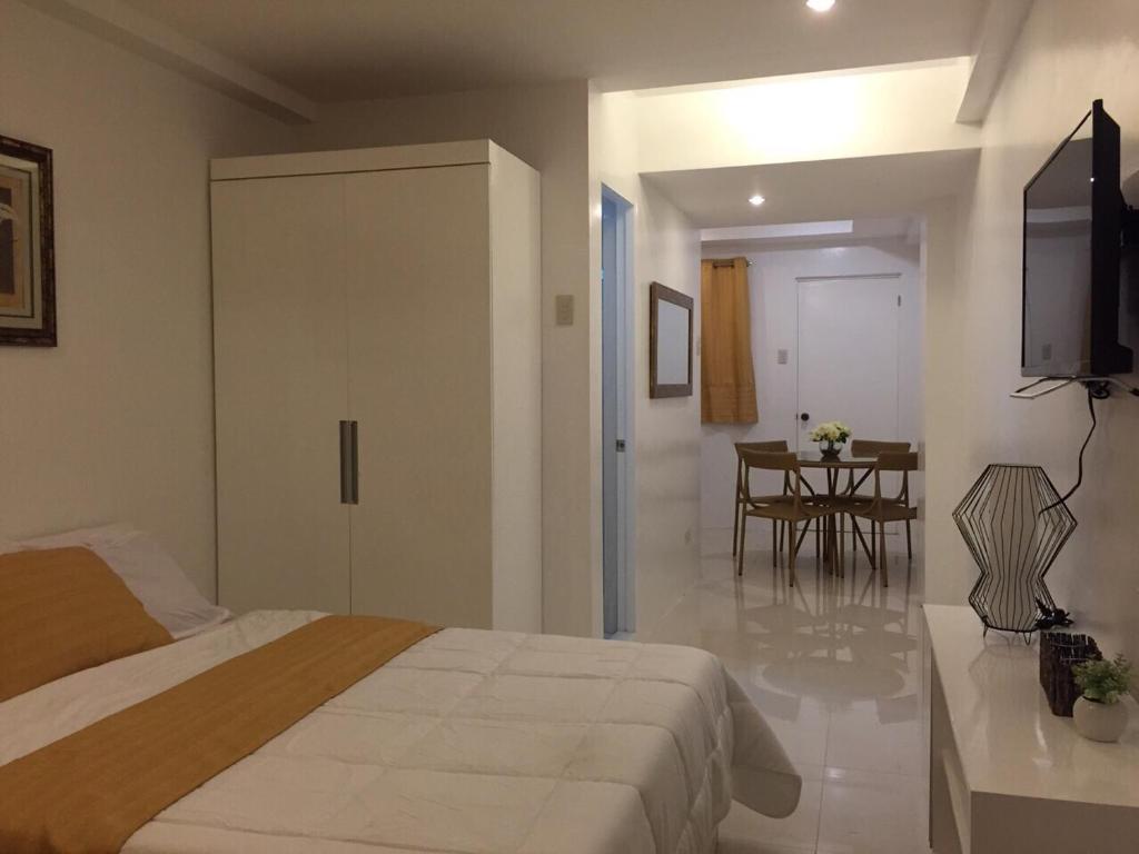 Postel nebo postele na pokoji v ubytování Alta Residences