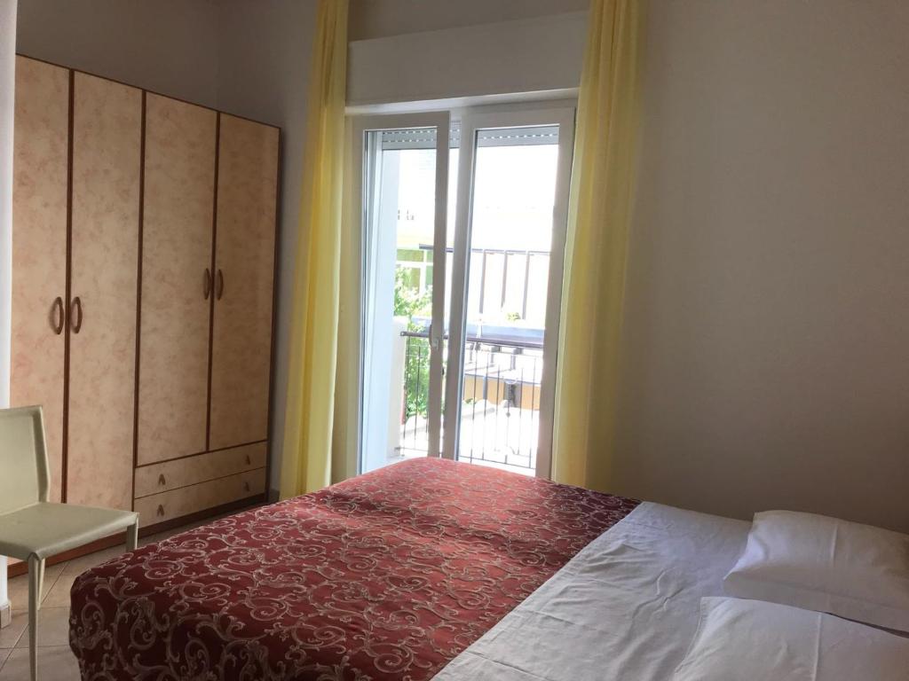 Postel nebo postele na pokoji v ubytování Hotel Ivana