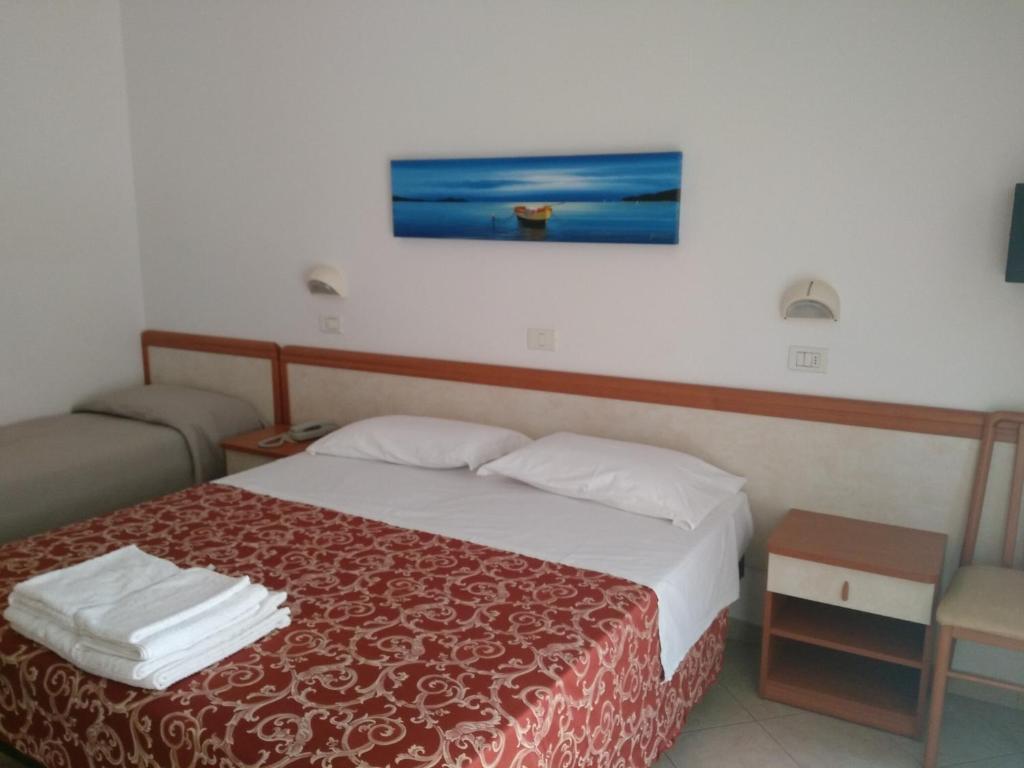 Postel nebo postele na pokoji v ubytování Hotel Ivana