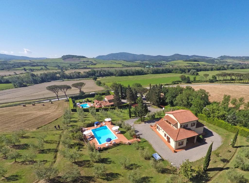 an aerial view of a house with a swimming pool at Agriturismo San Maurizio in Montecatini Val di Cecina