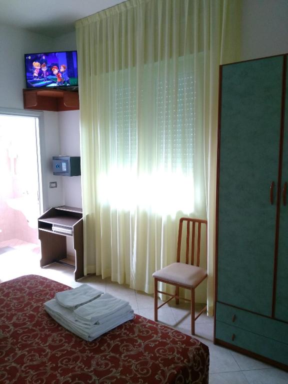 Postel nebo postele na pokoji v ubytování Hotel Ivana