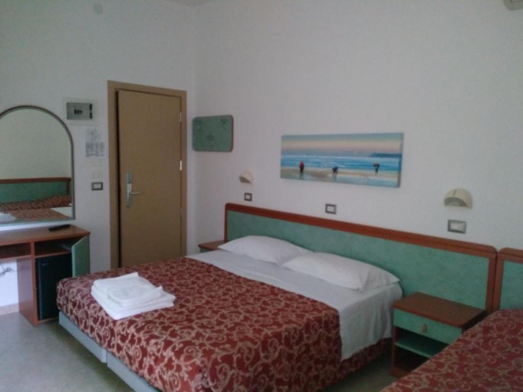 Postel nebo postele na pokoji v ubytování Hotel Ivana