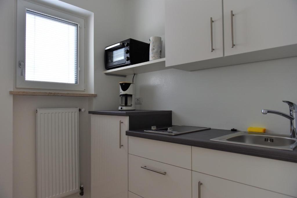 Kuchyň nebo kuchyňský kout v ubytování Haus Matha
