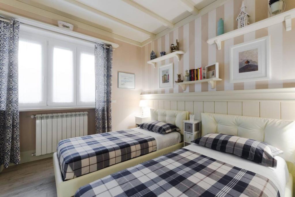 Postel nebo postele na pokoji v ubytování Serendipity B&B Pescara