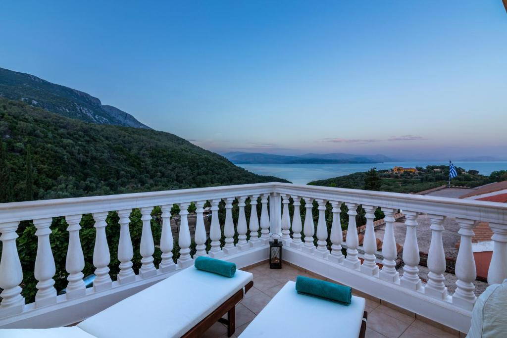 a balcony with a view of the ocean at Villa kortilles in Pyrgi