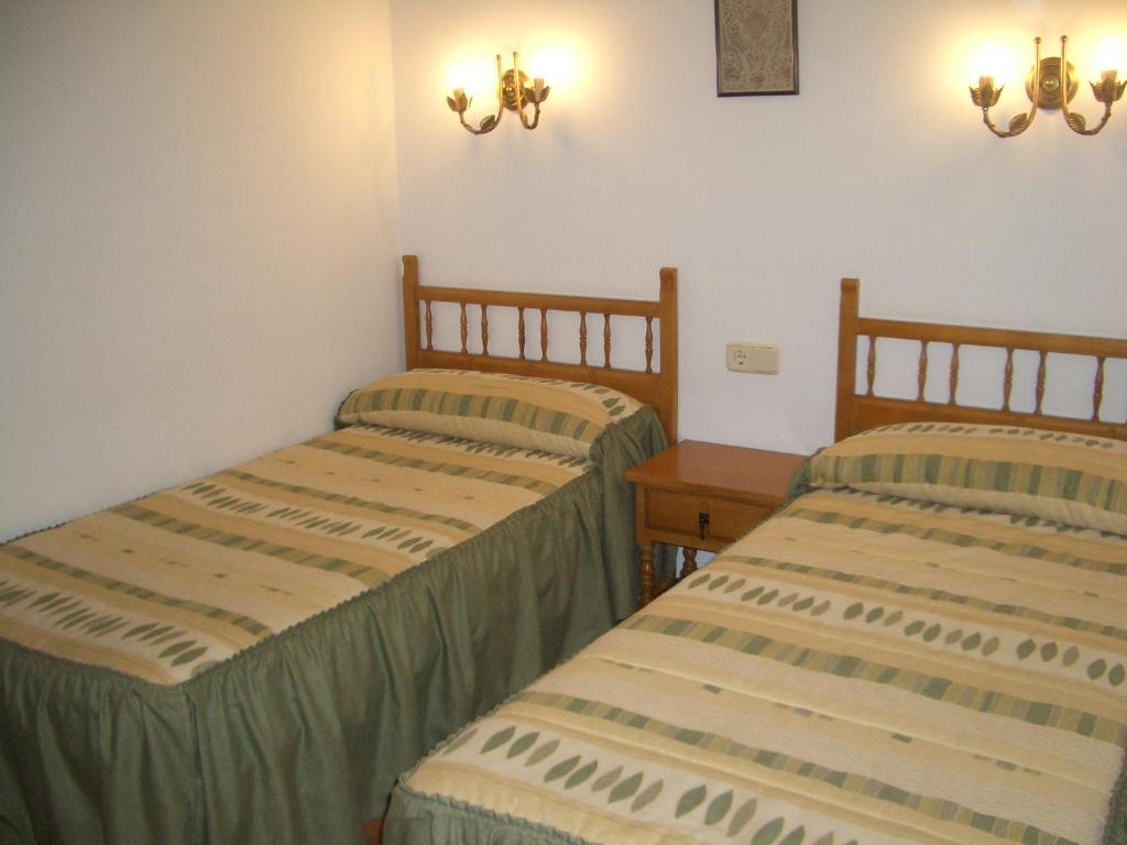 Postel nebo postele na pokoji v ubytování Hostal Vall d'Àssua