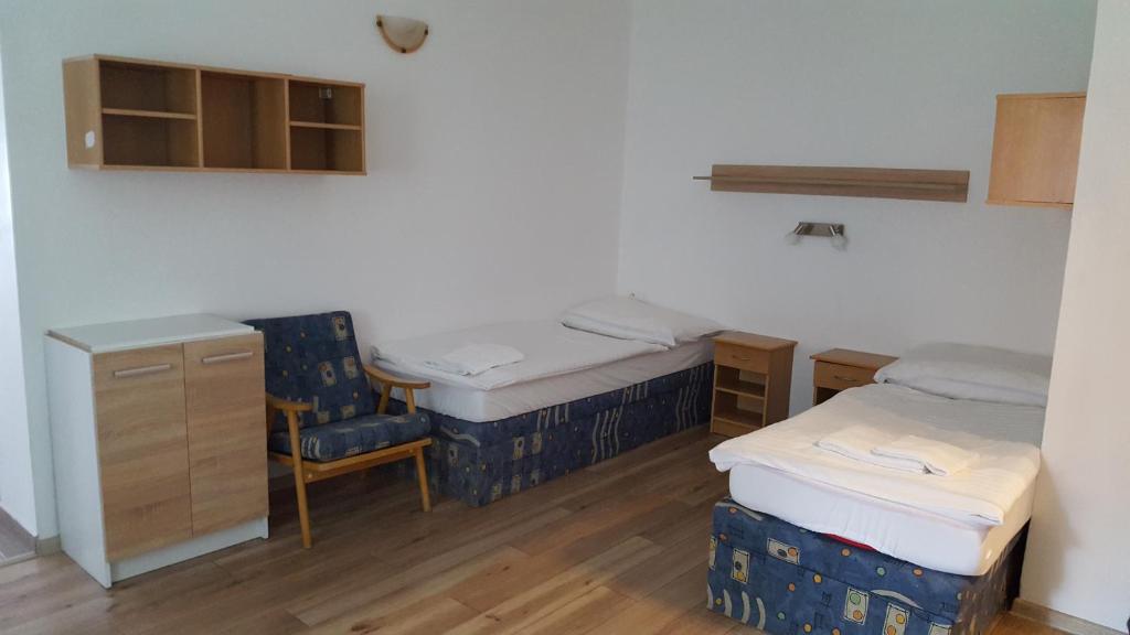 Postel nebo postele na pokoji v ubytování Chata Triomint