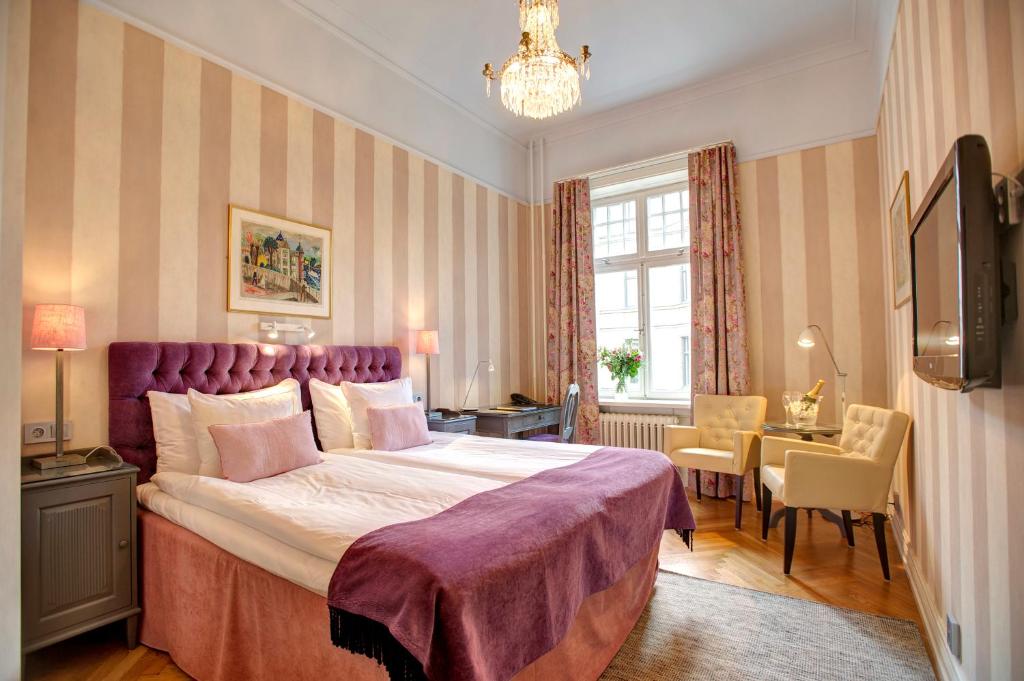 Postel nebo postele na pokoji v ubytování Hotel Kung Carl, WorldHotels Crafted