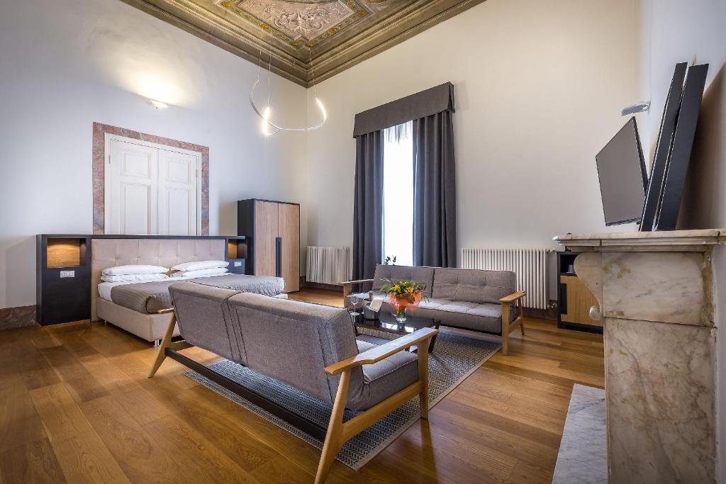 Łóżko lub łóżka w pokoju w obiekcie La Torre del Cestello - Residenza d'epoca