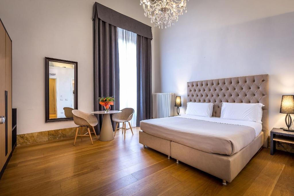 Łóżko lub łóżka w pokoju w obiekcie La Torre del Cestello - Residenza d'epoca