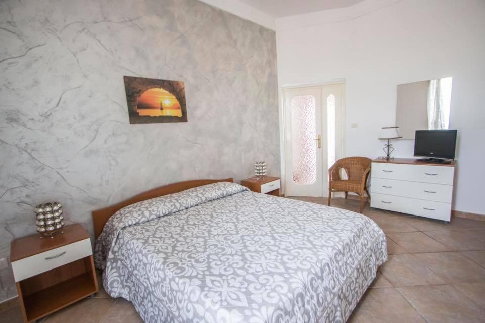 Postel nebo postele na pokoji v ubytování B&B "Posta di Colonna"