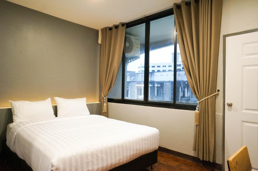 Ένα ή περισσότερα κρεβάτια σε δωμάτιο στο Lux Rooms Night Bazaar