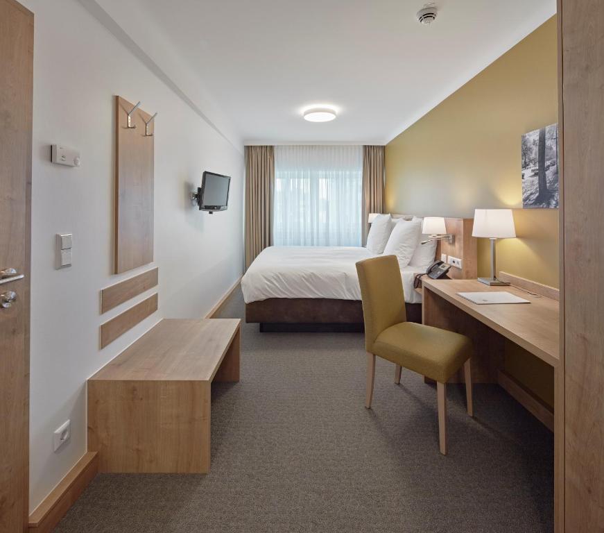 Postel nebo postele na pokoji v ubytování City Hotel