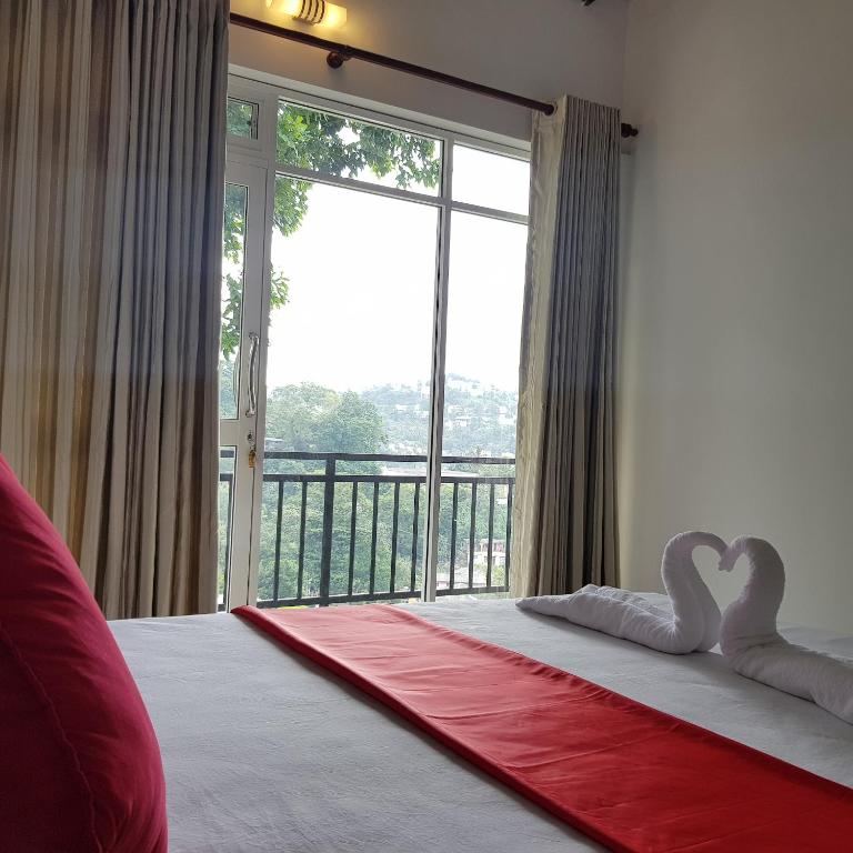 Postel nebo postele na pokoji v ubytování Jaye's Homestay