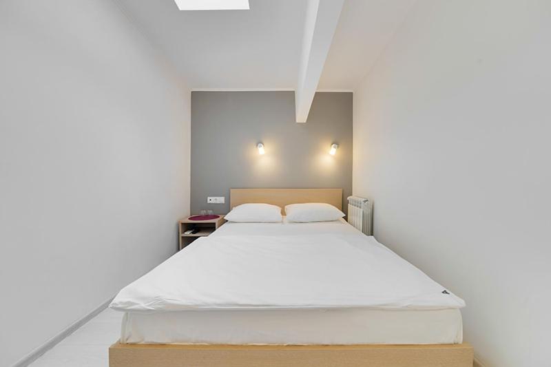 
Кровать или кровати в номере Минима Аэропорт
