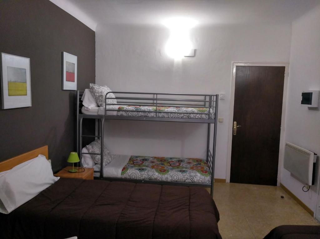 Postel nebo postele na pokoji v ubytování Hostal Juventus