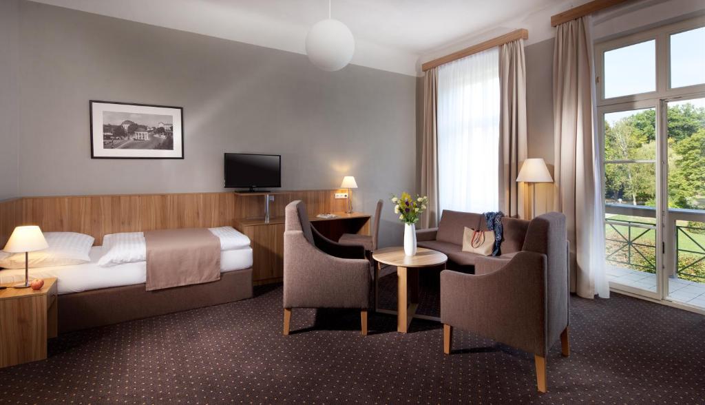 Postel nebo postele na pokoji v ubytování Badenia Hotel Praha