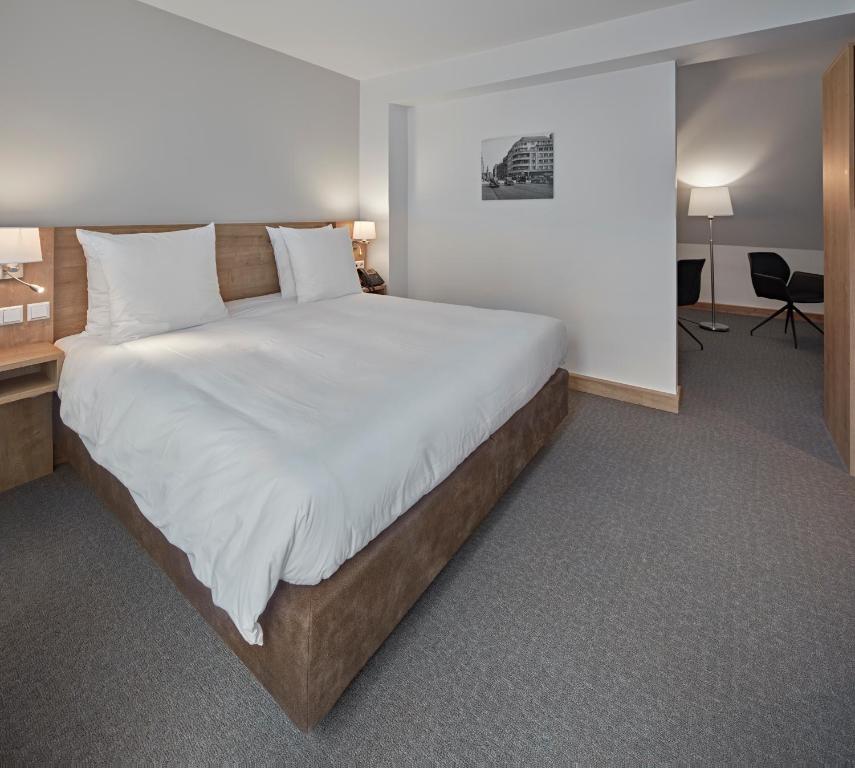 Postel nebo postele na pokoji v ubytování City Hotel