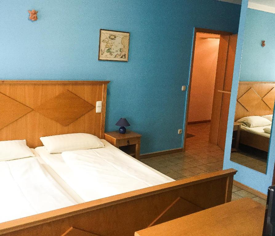 Postel nebo postele na pokoji v ubytování Pension Mona Lisa