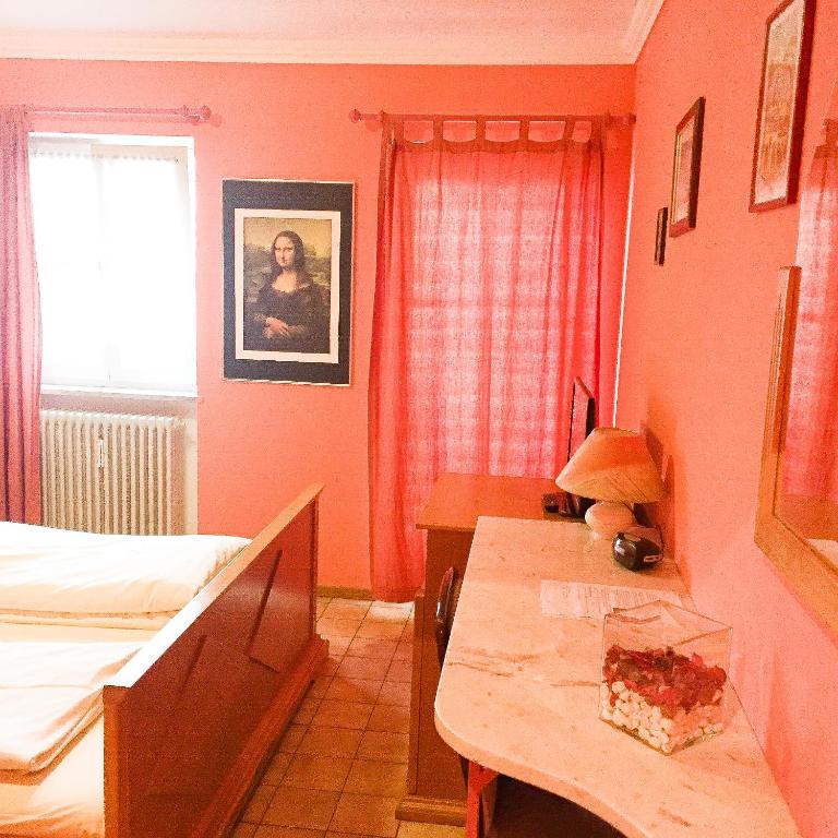 Postel nebo postele na pokoji v ubytování Pension Mona Lisa