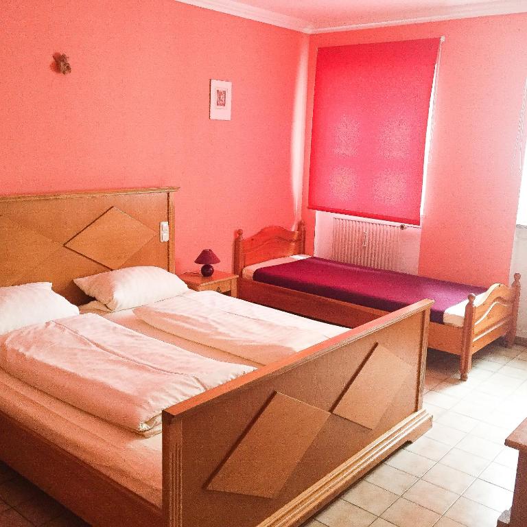 Postel nebo postele na pokoji v ubytování Pension Mona Lisa