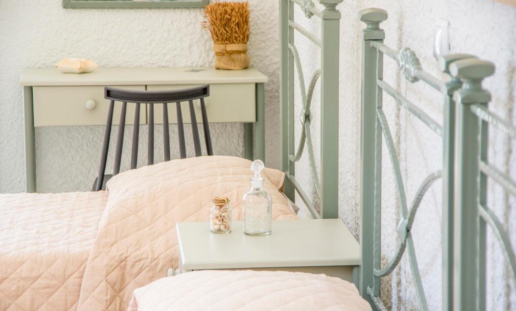 Postel nebo postele na pokoji v ubytování Syros INN