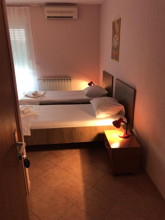 Postel nebo postele na pokoji v ubytování Guest House Ivo