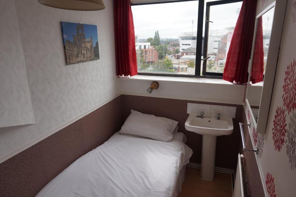 Postel nebo postele na pokoji v ubytování The Boundary Hotel - B&B