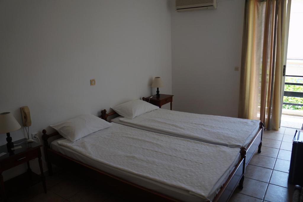Postel nebo postele na pokoji v ubytování Lemonies