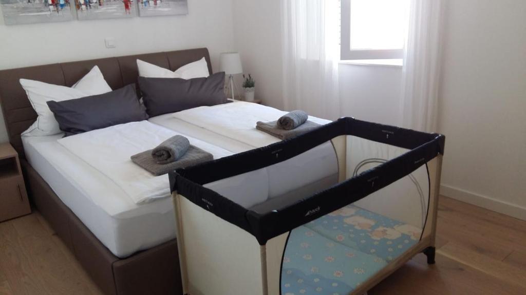 Posteľ alebo postele v izbe v ubytovaní Apartment ARIA Exclusive Petrcane