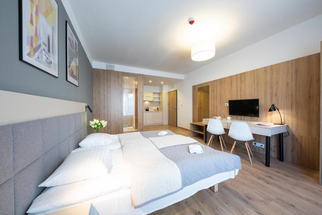 Posteľ alebo postele v izbe v ubytovaní Apartments "Wolska Residence"