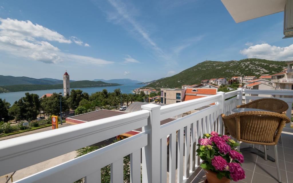 a balcony with a view of the water at Villa Doris in Neum