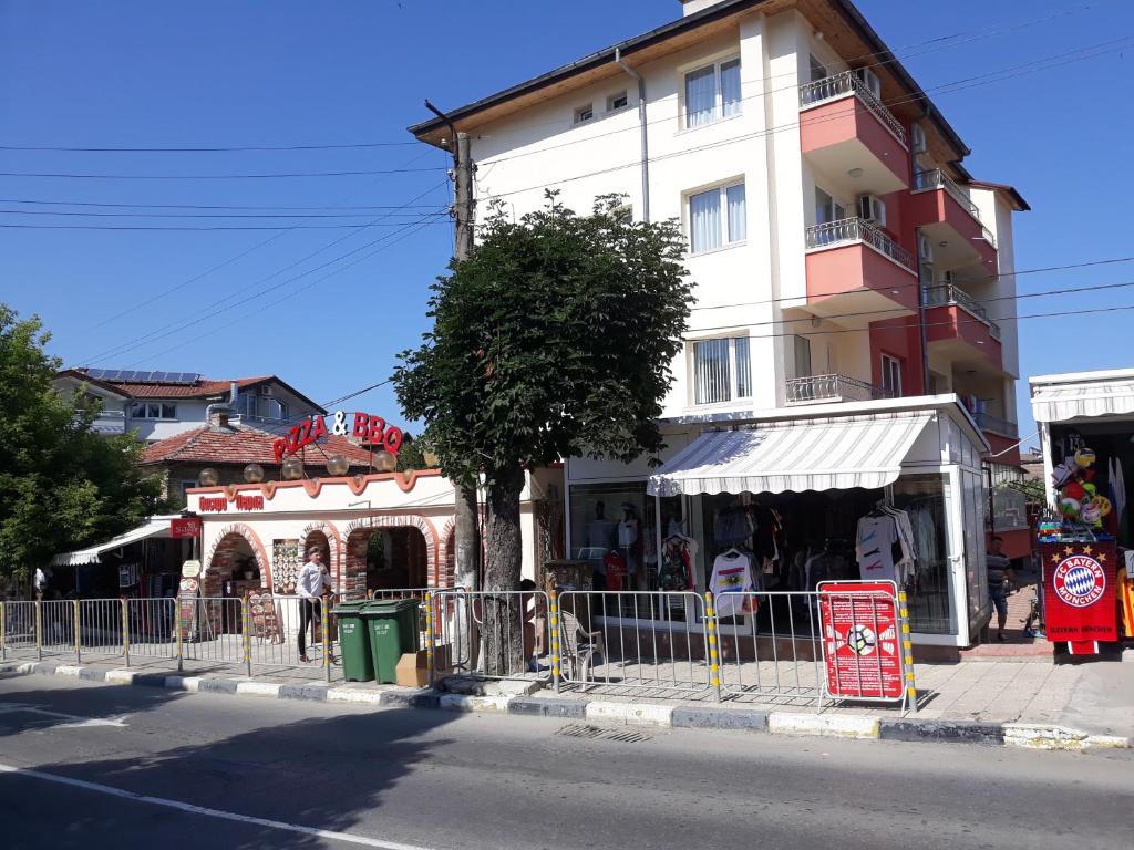 a building on the side of a city street at Guest House Perla in Obzor