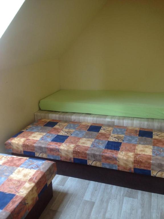 Postel nebo postele na pokoji v ubytování Chata u rybníka