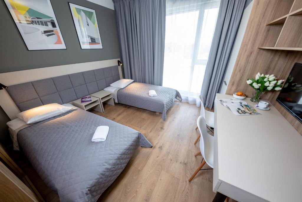 Posteľ alebo postele v izbe v ubytovaní Apartments "Wolska Residence"