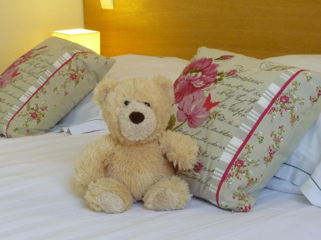 Postel nebo postele na pokoji v ubytování Hotel Ambrosia