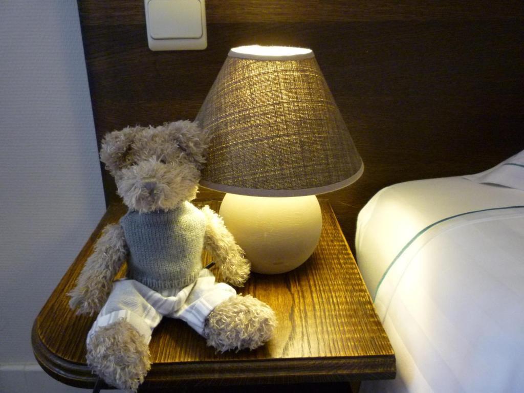 Postel nebo postele na pokoji v ubytování Hotel Ambrosia