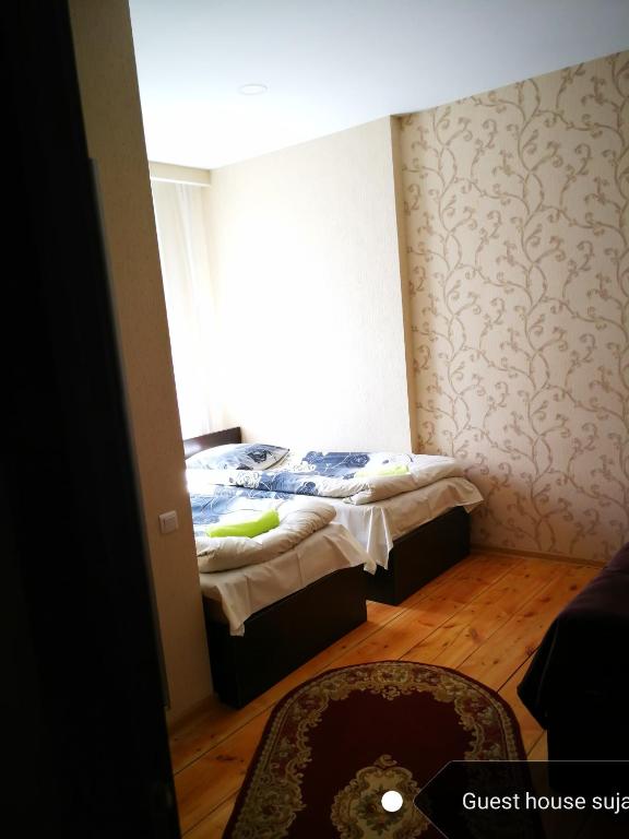 Postel nebo postele na pokoji v ubytování Guesthouse suja