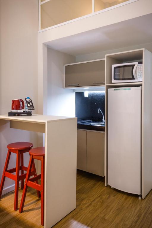 A cozinha ou cozinha compacta de Injoy Lofts & Studios Ipanema